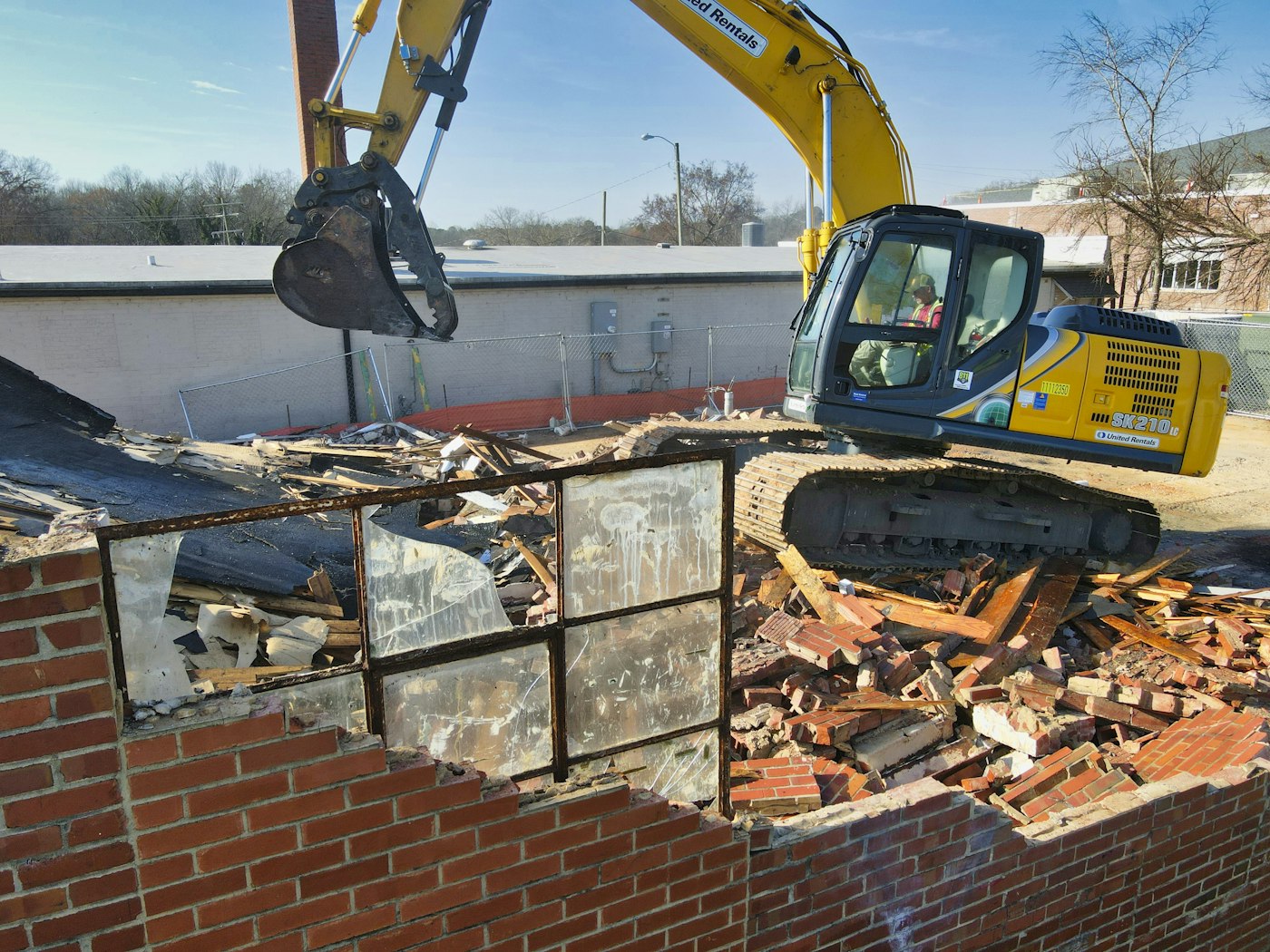 Heavy equipment working a demolition / construction site